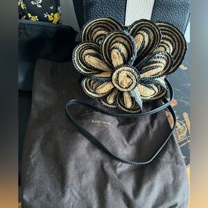 Kate Spade purse with storage bag.